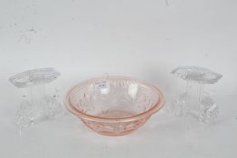 Moulded puce glass bowl with fleur de lis decoration, 21cm diameter, pair of moulded two branch