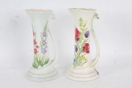 Pair of Elizabeth Radford vases, each of slender form, with painted flowers and swan neck handles,
