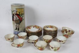German porcelain tea set decorated with fruit together with a french stick stand (Qty)