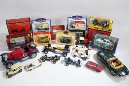 Collection of boxed diecast models, to include Matchbox Sierra Cosworth, Corgi Elf Tyrrell Project