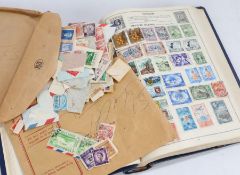 Movaleaf stamp album of Postage Stamps of the World, with part contents, with an envelope of loose