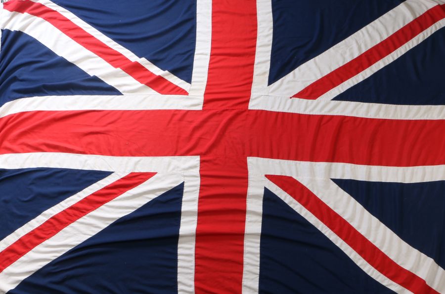 Large Union Flag, multi piece construction, approx. 253 cm x 158 cm, makers label for 'Flags &