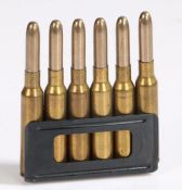 Pre Second World War charger clip of six 6.5mm Carcano rounds by SMI, dated 1936 to base, inert