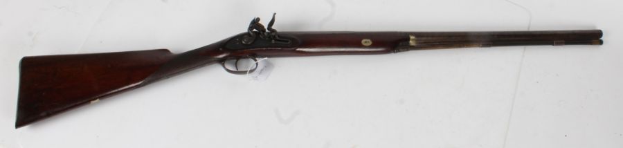 Early 19th century flintlock muzzle loading sporting gun, brown twist barrel octagonal at breech,