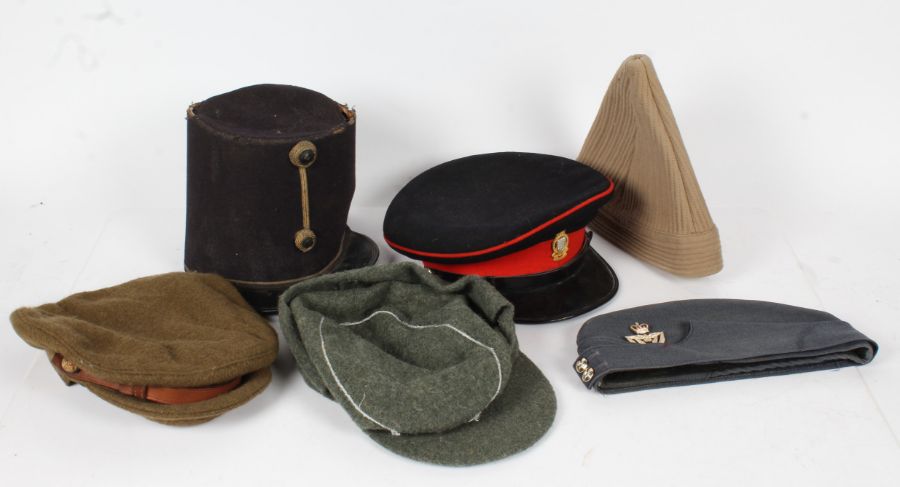 Selection of Military Headdress including, Royal Army Ordnance Corps officers cap by Moss Bros.