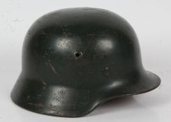 Second World War German M40 helmet, inside rim is stamped with the size '62' but no discernible