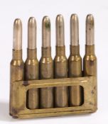 Pre Second World War charger clip of six 6.5mm Carcano rounds by SMI, dated 1936 to base, brass