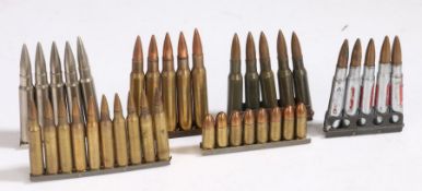 Selection of six charger clips of small calibre ammunition, 5.56mm, 9mm, .303 drill/training, 30-06,