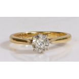 18ct gold ring, the head set with a single illusion set diamond and with pierced shoulders, ring