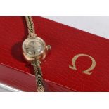 Omega 9 carat gold ladies wristwatch, the signed silver dial with baton markers, manual wound, the