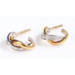 Pair of 18 carat and diamond earrings, set with two overlapping bands one set with round cut