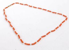 Coral and pearl necklace, the necklace set with coral beads intersected with pearls set on a 9 carat