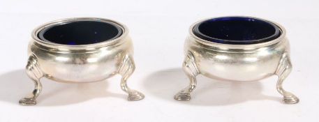 Pair of George II silver salts, London 1737, makers marks rubbed, of cauldron form, each raised on