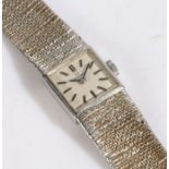 Omega 9 carat white gold ladies wristwatch, the signed silver dial with baton markers, manual wound,