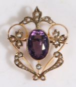 A 9 carat gold pearl and amethyst set brooch, the oval amethyst with a pearl on leaf et surround,