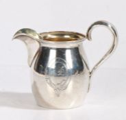 A 19th Century Russian silver cream jug, stamped to interior base, the bulbous body with oval