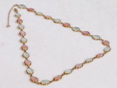 A 9 carat gold and pearl necklace, with halved pink and white pearls, 46cm long, 10g