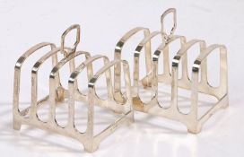Matched pair of Elizabeth II silver toast racks, one Sheffield 1960, the other Sheffield 1983, maker