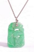 Jade and diamond pendant, the jade pendant carved as various animals climbing a tree, with a white