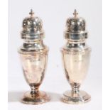 Pair of Elizabeth II silver sugar castors, Sheffield 1983, maker Walker & Hall, the scroll pierced