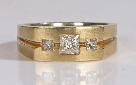 14 carat gold ring set with a central square cut diamond flanked by two smaller square cut diamonds,