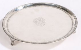 A George III silver waiter, London 1782, maker James Stamp, of circular form, with central crest
