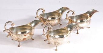 Four Elizabeth II silver sauceboats, Sheffield 1983, maker Walker & Hall, with double scroll handles