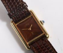 A Cartier Must de Cartier ladies silver gilt wristwatch, with signed chocolate colour dial, manual