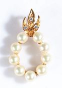 9 carat gold pearl and diamond set pendant, the pendant set with nine pearls and three round cut