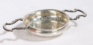 George II silver lemon strainer, London circa 1750, maker WM, the bowl of circular form with pierced