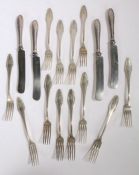 Set of twelve Continental silver table forks, the scroll cast handles initialled T, stamped 800