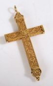 22 carat gold filigree cross, of swag and loop to the top, tested as 22 carat gold, 38.7mm wide,