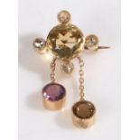 18 carat brooch, set with a central citrine with diamond surround and two amethyst drops, 17mm wide,