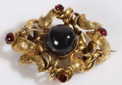 A Victorian brooch, set with cabochon cut garnets and a hair panel to reverse, tested as 18 carat