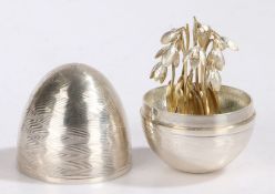 Nicholas Plummer silver "surprise" egg in the manner of Stuart Devlin, London 2004, the wavy lined