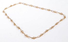 18 carat gold necklace, formed of interlocking pieces, stamped 750, approx 70cm long weight 23.5
