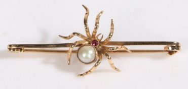 A 15 carat gold spider brooch, with a pearl and ruby set body,  63mm wide, 7.4g