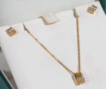 Suite of 18 carat gold and diamond jewellery to include a necklace and pendant set with four round