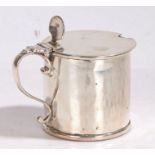 George III silver mustard pot, London 1777, maker Thomas Daniell, of drum form, the hinged lid
