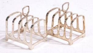 Pair of Elizabeth II silver toast racks, Sheffield 1960, maker Walker & Hall, with arched pierced