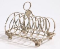 George IV silver toast rack, London 1824, maker WE, the oval loop carrying handle above an oval