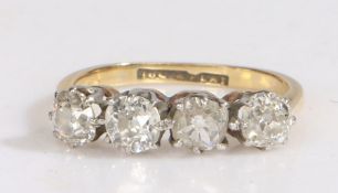 An 18 carat gold and four stone diamond ring, the four old brilliant cut diamonds claw set in