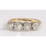 An 18 carat gold and four stone diamond ring, the four old brilliant cut diamonds claw set in