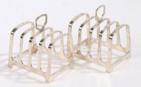 Pair of Elizabeth II silver toast racks, Sheffield 1960, maker Walker & Hall, with arched pierced