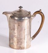 George III silver hot water pot, London 1816, maker RC or RG, with gadrooned rim and turned