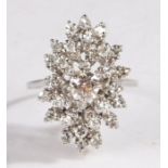 Diamond cluster ring, the round cut diamonds set to a spray design, the central diamond
