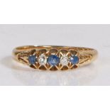 18 carat gold diamond and sapphire ring, the head set with three sapphires intersected by two