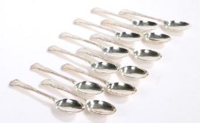 Twelve Elizabeth II silver dessert spoons, Sheffield 1960 and 1983, maker Walker & Hall, with