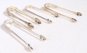 Four pairs of George III and later silver sugar tongs, London 1800, maker William Eley & William