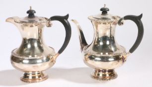 Elizabeth II silver coffee pot and hot water jug, Sheffield 1983, maker Walker & Hall, with ebony